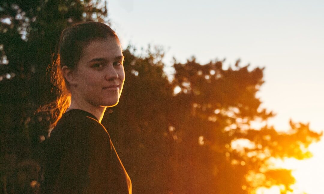 Smiling young Scandinavian woman outdoors in natural light