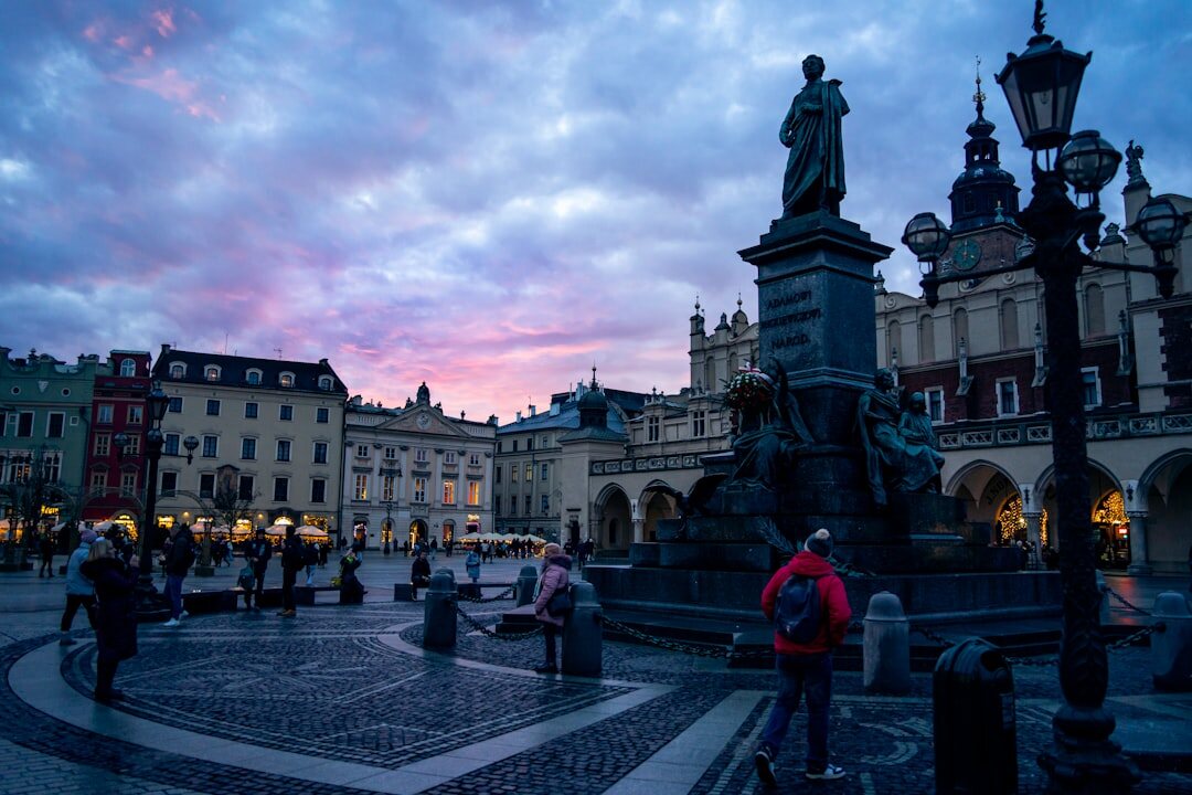 Busy market square in a European town at dusk