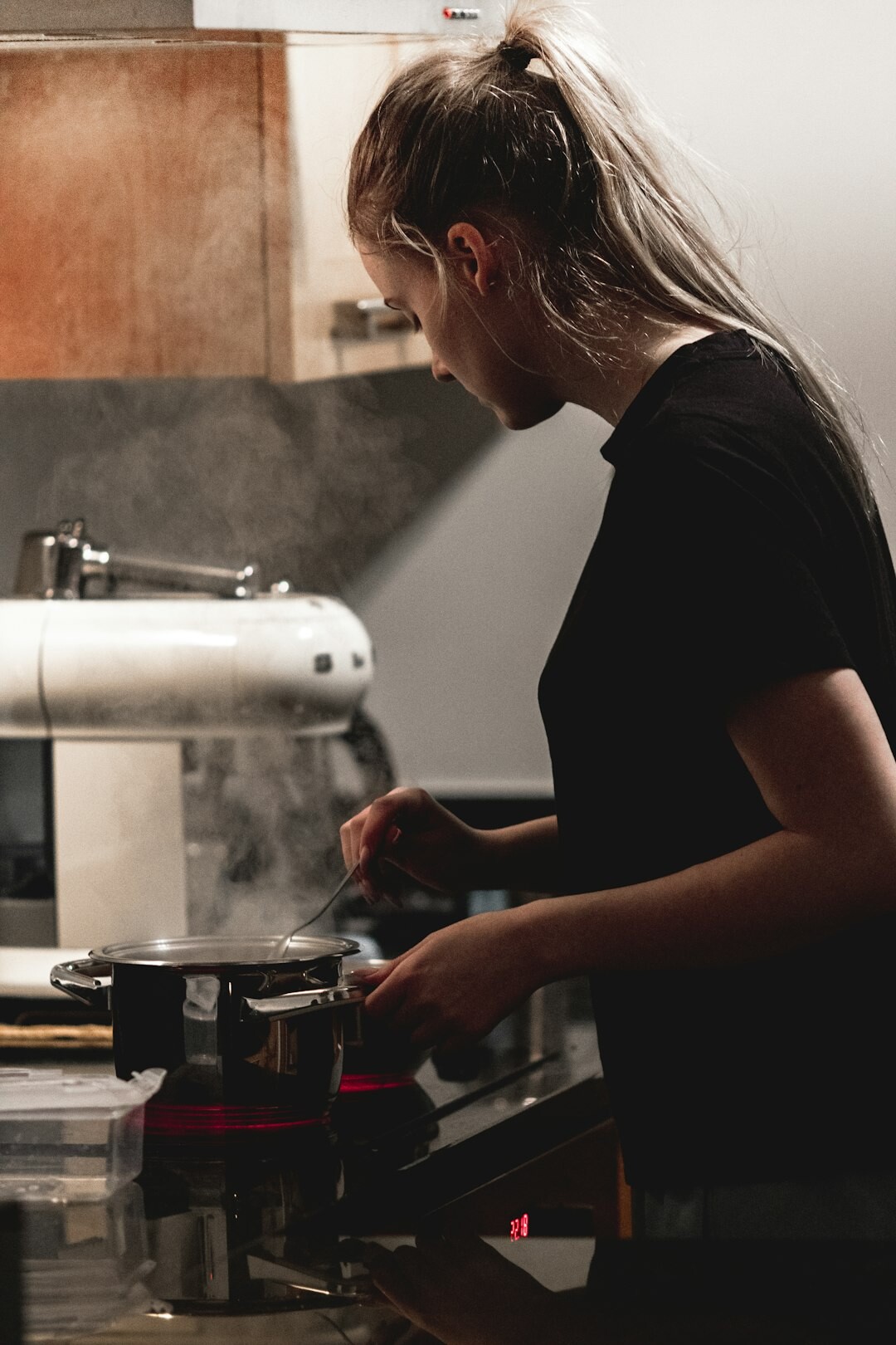 Woman preparing food in a bright kitchen